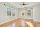 Bright bedroom features hardwood floors, plenty of natural light, and modern ceiling fan at 404 W 19Th St, Sanford, FL 32771