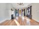 Open concept living space features hardwood floors, fireplace, and large windows at 404 W 19Th St, Sanford, FL 32771