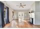 Spacious living area with hardwood floors, white brick fireplace and french doors at 404 W 19Th St, Sanford, FL 32771