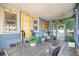 Inviting screened porch featuring a dining area, ample seating, and charming string lights at 404 W 19Th St, Sanford, FL 32771