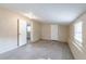Unfinished basement with a window, concrete floor, and door to another room at 424 S Observatory Dr, Orlando, FL 32835