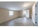 Unfinished basement with a window and open doorway to another room with a bathtub at 424 S Observatory Dr, Orlando, FL 32835