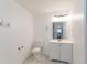 Bathroom featuring a tiled floor, a toilet, a vanity with sink, and a mirror at 424 S Observatory Dr, Orlando, FL 32835
