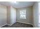 Cozy bedroom with a closet, soft carpeting, and a bright window with natural light at 424 S Observatory Dr, Orlando, FL 32835