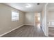 Bedroom with laminate flooring, a window for natural light, and light, neutral walls at 424 S Observatory Dr, Orlando, FL 32835