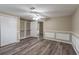Bedroom with laminate flooring, a ceiling fan, and open closet space at 424 S Observatory Dr, Orlando, FL 32835
