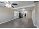 Open living room with neutral walls, modern flooring, and a view into the kitchen at 424 S Observatory Dr, Orlando, FL 32835