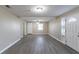 Bright living room with hard surface flooring and open layout, offering versatile space at 424 S Observatory Dr, Orlando, FL 32835