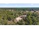 Aerial view of the lush, wooded surrounding landscape at 4356 Sw Dahlia Ct, Dunnellon, FL 34431
