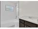 Bright bathroom boasts shower-tub, granite countertop vanity and updated fixtures at 4356 Sw Dahlia Ct, Dunnellon, FL 34431