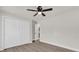 Bright bedroom features ceiling fan, wood-look floors, and large closet space at 4356 Sw Dahlia Ct, Dunnellon, FL 34431