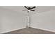 Neutral bedroom featuring sleek ceiling fan, wood flooring, and ample lighting at 4356 Sw Dahlia Ct, Dunnellon, FL 34431