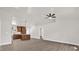 Bright and airy open-concept living space with wood floors and ceiling fan at 4356 Sw Dahlia Ct, Dunnellon, FL 34431