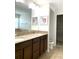 Bathroom boasts double vanity, granite countertop, and linen closet at 4636 Southlawn Ave, Orlando, FL 32811