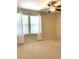 Bright bedroom with neutral walls and carpeting at 4636 Southlawn Ave, Orlando, FL 32811