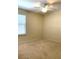Spacious bedroom with carpeted floor and ceiling fan at 4636 Southlawn Ave, Orlando, FL 32811