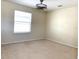 Bright bedroom featuring carpeted floors and a window with blinds at 4636 Southlawn Ave, Orlando, FL 32811