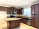 Modern kitchen featuring granite countertops and ample cabinetry at 4636 Southlawn Ave, Orlando, FL 32811