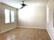 Spacious living room with tile flooring and neutral walls at 4636 Southlawn Ave, Orlando, FL 32811