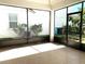 Screened-in porch with tile flooring and backyard access at 4636 Southlawn Ave, Orlando, FL 32811