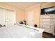 Bedroom featuring neutral colored walls, closet and dresser at 5405 Napoli Cv, Lake Mary, FL 32746