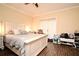 Bright bedroom with a large bed, laminate flooring, and a sliding glass door at 5405 Napoli Cv, Lake Mary, FL 32746