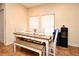 Dining table with white chairs and bench seating, and decorative accents at 5405 Napoli Cv, Lake Mary, FL 32746