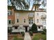 Charming multi-story townhome featuring stucco walls, red tile accents, and manicured landscaping at 5405 Napoli Cv, Lake Mary, FL 32746