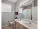 Bathroom with double vanity, shower, and updated fixtures at 6361 New Independence Pkwy, Winter Garden, FL 34787