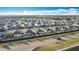 Neighborhood aerial view showcasing a variety of homes in a well-planned community with manicured lawns and streets at 651 Tortugas St, Haines City, FL 33844