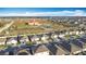 Wide aerial shot showing rooftops of a residential neighborhood with community buildings and green spaces at 651 Tortugas St, Haines City, FL 33844