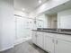 Stylish bathroom featuring granite countertop, white vanity, and glass-enclosed shower at 651 Tortugas St, Haines City, FL 33844