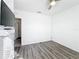 Simple bedroom featuring wood floors and a TV, ready for personal touches at 651 Tortugas St, Haines City, FL 33844