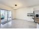 Bright dining area features modern lighting, tile flooring, and sliding glass doors to the outdoor patio at 651 Tortugas St, Haines City, FL 33844
