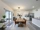 Dining area with a wooden table, leather chairs, and a view to the outdoor patio through sliding glass doors at 651 Tortugas St, Haines City, FL 33844
