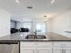 Modern kitchen with a stainless steel dishwasher and granite countertops at 651 Tortugas St, Haines City, FL 33844