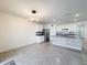 Bright, open kitchen featuring stainless steel appliances and a breakfast bar with modern countertops at 651 Tortugas St, Haines City, FL 33844