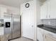 View of the kitchen featuring stainless steel refrigerator and convenient access to the pantry at 651 Tortugas St, Haines City, FL 33844