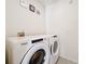 Laundry room with Whirlpool washer and dryer, and decorative wall hangings, is functional at 651 Tortugas St, Haines City, FL 33844