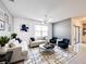 Stylish living room features modern furnishings, contemporary art, and a neutral color palette, creating an inviting atmosphere at 651 Tortugas St, Haines City, FL 33844