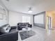 Stylish living room featuring modern decor, comfortable seating, and tile flooring at 651 Tortugas St, Haines City, FL 33844