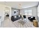 Inviting living room with tile floors, modern furnishings, and a view into the dining area at 651 Tortugas St, Haines City, FL 33844