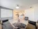 Spacious living room with tile floors and access to the kitchen, great for entertaining at 651 Tortugas St, Haines City, FL 33844
