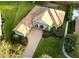 Aerial view of home showcasing its beautiful landscaping, brick driveway, and private pool at 6533 Cartmel Ln, Windermere, FL 34786
