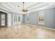 Spacious bedroom with tray ceilings and access to the lanai at 6533 Cartmel Ln, Windermere, FL 34786