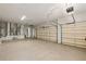 Spacious three car garage featuring epoxy flooring and ample storage space at 6533 Cartmel Ln, Windermere, FL 34786
