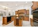 Gourmet kitchen with wooden cabinets, granite countertops and stainless steel appliances at 6533 Cartmel Ln, Windermere, FL 34786