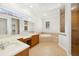 Bright bathroom with soaking tub, glass shower, and double vanity at 6533 Cartmel Ln, Windermere, FL 34786