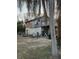 Unfinished wooden house with a small deck at 310 Lake Ave, Dundee, FL 33838