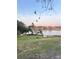 Lakefront property with grassy area and trees at 310 Lake Ave, Dundee, FL 33838